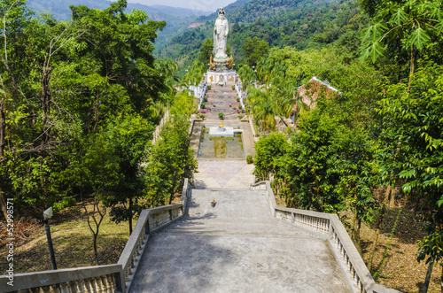 Fotografia, Obraz statue Goddess of Mercy Kuan Yin in mountains Thailand