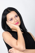 © skyfotostock - Beautiful brunette posing with one hand to her face