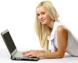 © lenets_tan - businesswoman lying on the floor and working on a laptop.