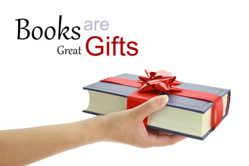 Woman's hand holding a book for gift