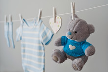 Blue Baby Clothes On The Clothesline