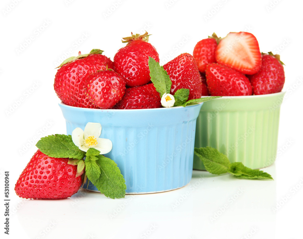 Ripe sweet strawberries in bowls, isolated on white