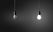 © chones - One broken and one glowing bulb. Idea concept