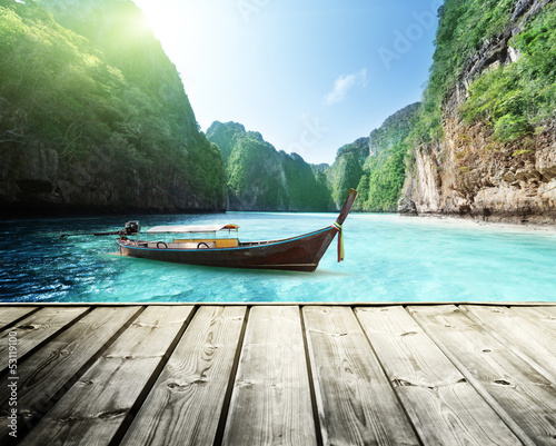 Fototapeta na wymiar rock of Phi Phi island in Thailand and wooden platform