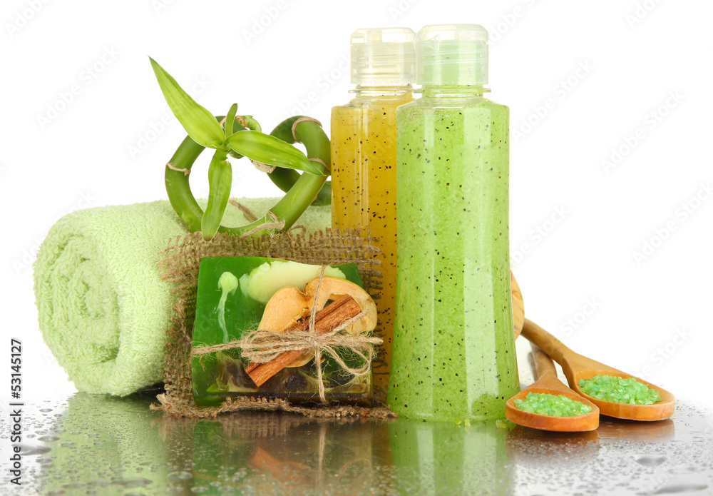 Bottles with scrub and hand-made soap, isolated on white
