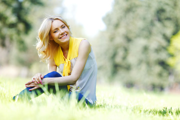 Woman sitting on grass