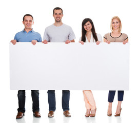 Wall Mural - Group Of Friends Holding Placard