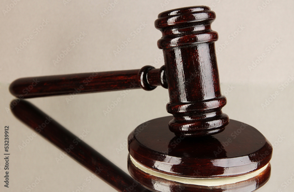 Wooden gavel on grey background