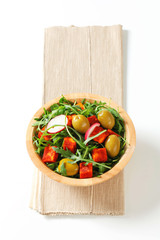 Wall Mural - Salad greens with olives and spicy cheese