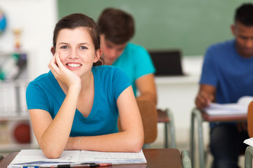 teenage high school girl sitting in classroom