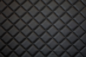 Fototapeta black leather texture of sofa closeup shot