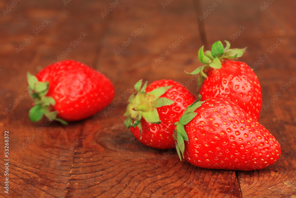 Fresh strawberry on wooden background