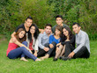 © Fotos 593 - Happy group of students sitting at the park
