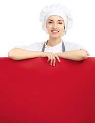 Happy woman cook or baker holding over paper sign billboard.