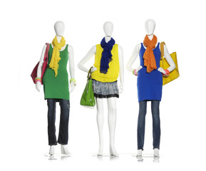 Wall Mural - female colorful dress with bag ,scarf on three mannequin