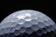 © shefkate - A close-up of a golf ball over dark background