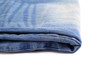© indigolotos - Blue jeans folded isolated on white