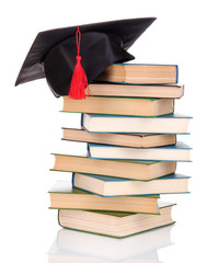 Wall Mural - Grad hat with books isolated on white