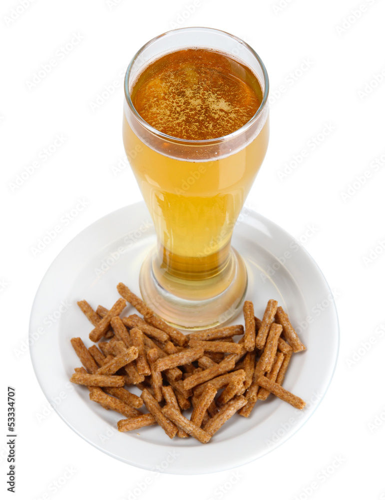 Beer in glass and croutons isolated on white