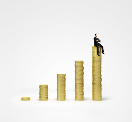 Poster - man sitting on coins