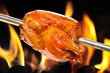roasted chicken on flame background