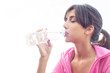 © Glamy - Young caucasian woman drinking water from a bottle