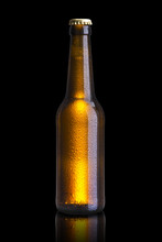 Cold Beer Bottle On Black Background