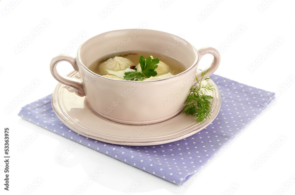 Tasty khinkali in .saucepan, isolated on white