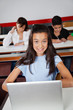 © Tyler Olson - Teenage Schoolgirl Sitting With Laptop At Desk