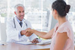© WavebreakmediaMicro - Doctor shaking hands to patient