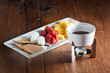 Chocolate fondue with dipping fruit and marshmallow treats
