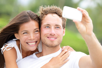 Wall Mural - Couple fun taking self-portrait picture photos