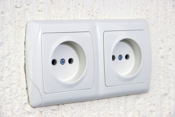 Two sockets  on wall