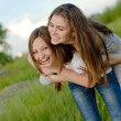 © stormy - Two Teen Girl Friends Laughing  in spring or summer