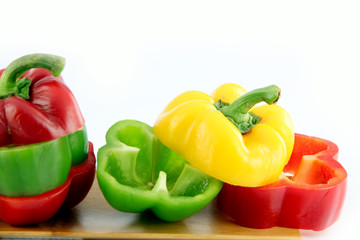 Zoom the Three color of bell pepper in the Bamboo dish.