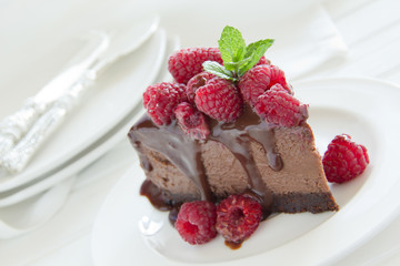 Chocolate cheesecake with raspberries.