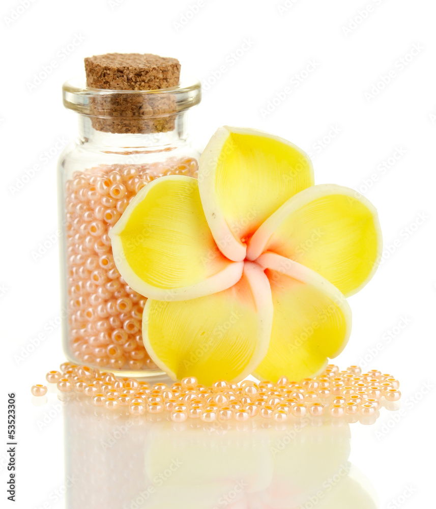 Little bottle full with colorful beads isolated on white