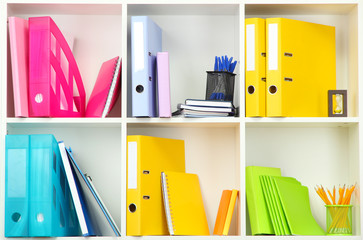 Wall Mural - White office shelves with different stationery, close up