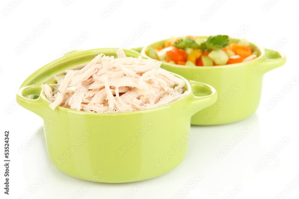 Shredded boiled chicken in green pan isolated on white