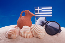 Amphora And Greece Flag On A Beach
