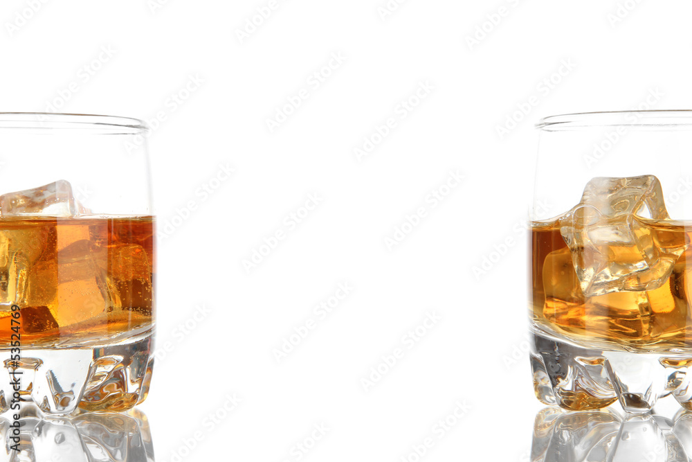 Brandy glasses with ice isolated on white