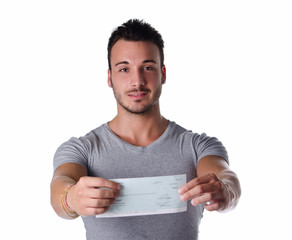 Happy young man showing check in his hands