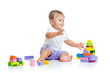 baby girl playing with construction set toy