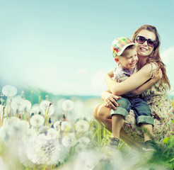 Attractive woman playing with her son