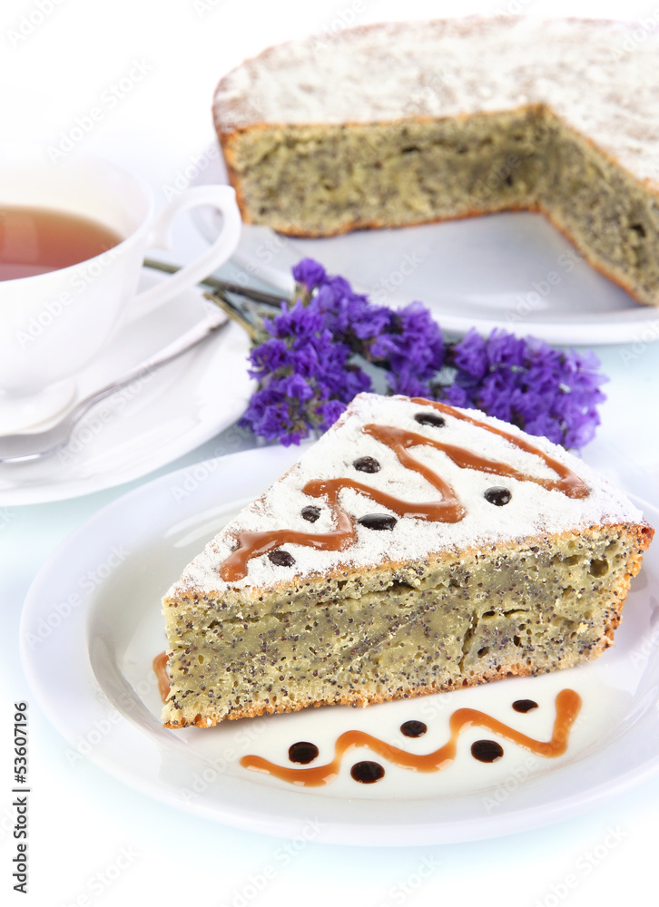 Delicious poppy seed cake with cup of tea isolated on white