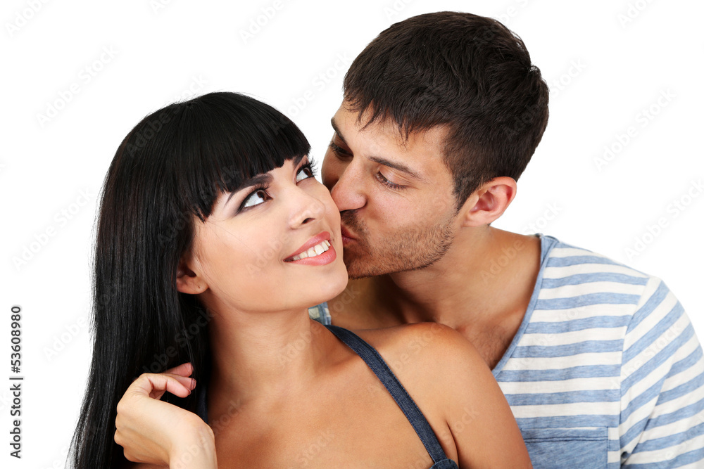 Beautiful loving couple kissing isolated on white
