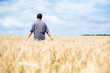 © slasnyi - young farmer in a wheat field