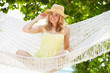 © Monkey Business - Woman Relaxing In Beach Hammock