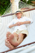 © Monkey Business - Senior Man Relaxing In Beach Hammock