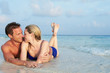 © Monkey Business - Romantic Couple Lying In Sea On Tropical Beach Holiday